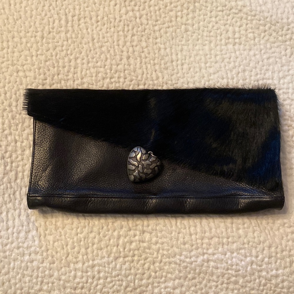Cara Landy black leather clutch